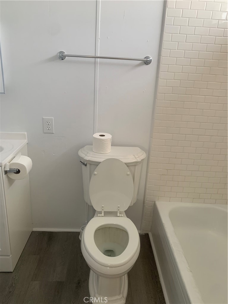 2865 West Rialto Avenue, Unit 2 Rialto, CA 92376 - Photo 15 of 19 a bathroom with a toilet a sink and bathtub
