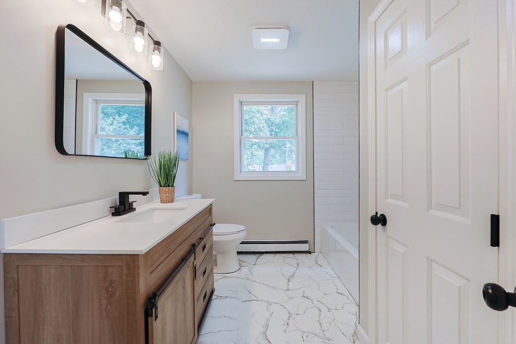 5 East Public Street Freetown, MA 02702 - Photo 27 of 41 a bathroom with a sink a toilet and shower