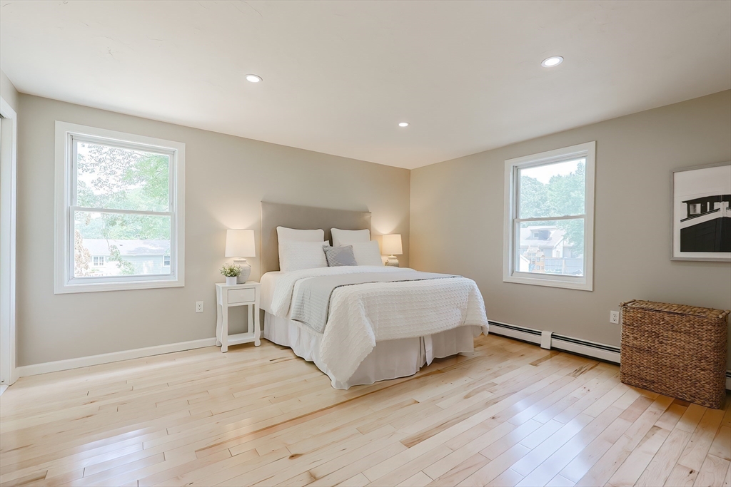 5 East Public Street Freetown, MA 02702 - Photo 32 of 41 a bedroom with a bed and wooden floor