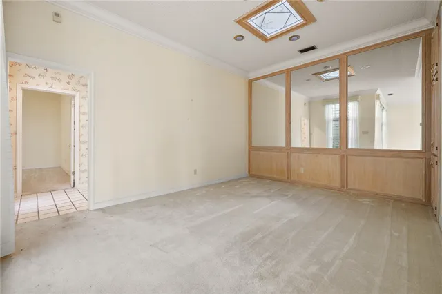 a kitchen with a stove a sink and cabinets