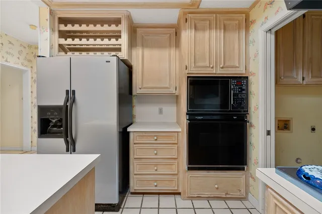 an empty room with a ceiling fan and carpet