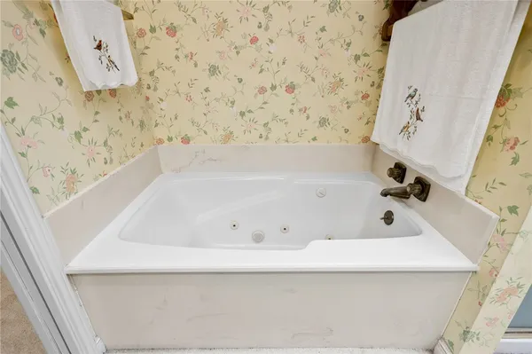 a view of a bathroom with a shower and a sink