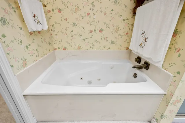 a view of a bathroom with a shower and a sink