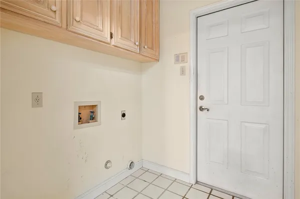 a view of a storage & utility room with two washing machine