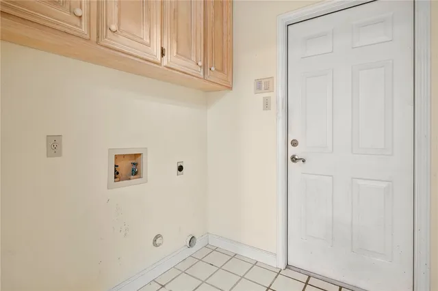 a view of a storage & utility room with two washing machine