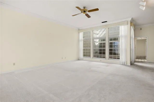 an empty room with a empty space and windows