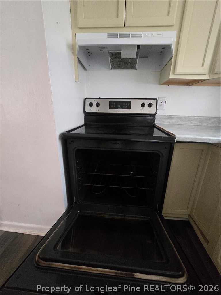 206 South 7th Street Spring Lake, NC 28390 - Photo 16 of 38 a refrigerator sitting inside of a kitchen