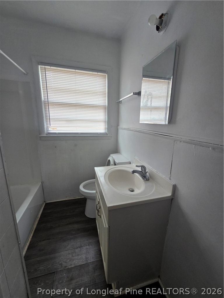 206 South 7th Street Spring Lake, NC 28390 - Photo 22 of 38 a bathroom with a sink toilet and mirror