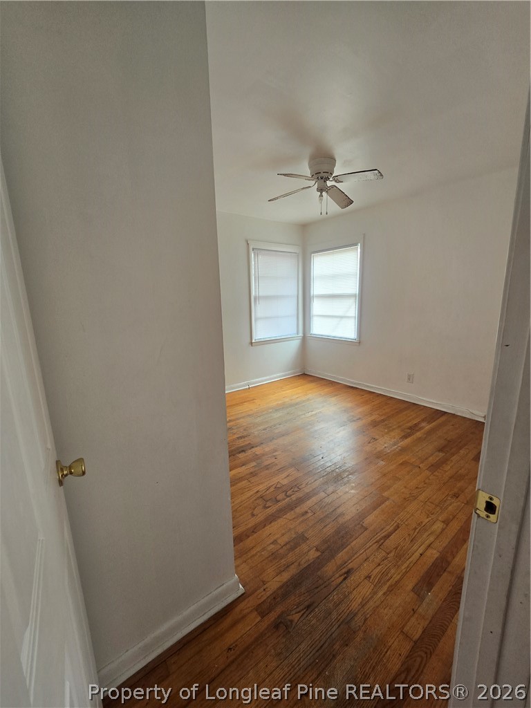 206 South 7th Street Spring Lake, NC 28390 - Photo 25 of 38 an empty room with wooden floor and windows