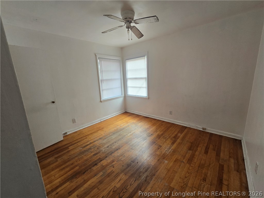 206 South 7th Street Spring Lake, NC 28390 - Photo 30 of 38 an empty room with wooden floor and windows