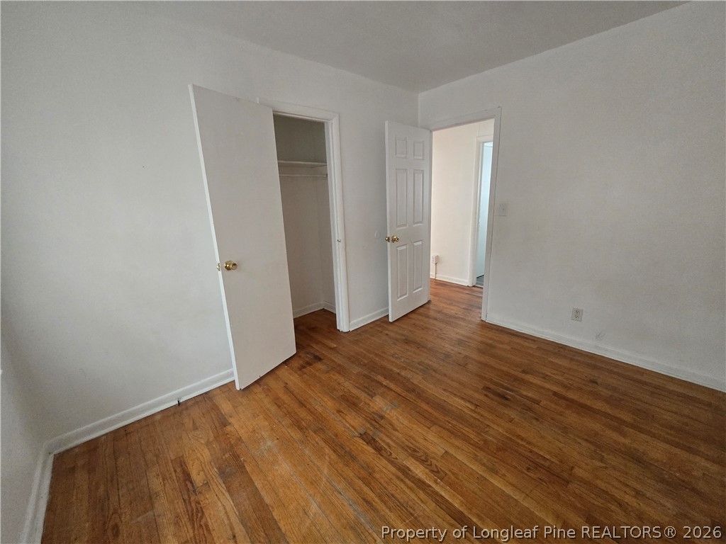 206 South 7th Street Spring Lake, NC 28390 - Photo 33 of 38 an empty room with wooden floor