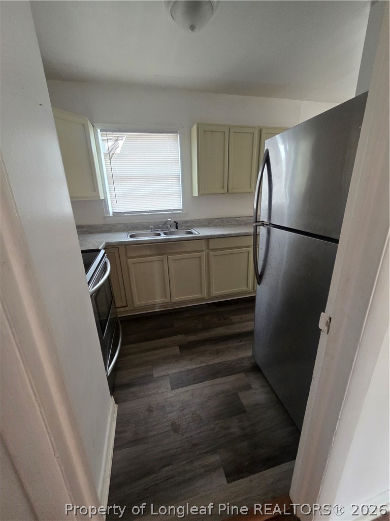 206 South 7th Street Spring Lake, NC 28390 - Photo 10 of 38 a kitchen with a refrigerator and a sink