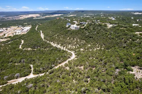 a view of a city with mountains in the background
