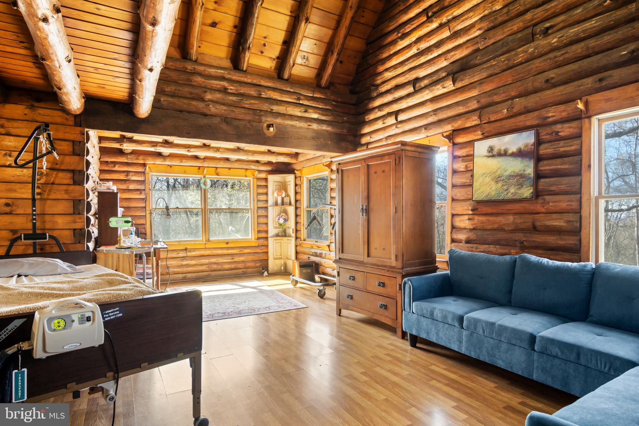 1402 Hoffmaster Road Knoxville, MD 21758 - Photo 2 of 50 Gorgeous exposed logs in living room
