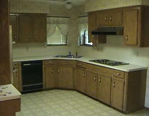 a kitchen with sink cabinets and stove