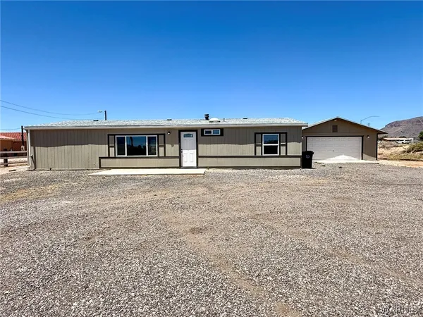 a view of a house with a big yard