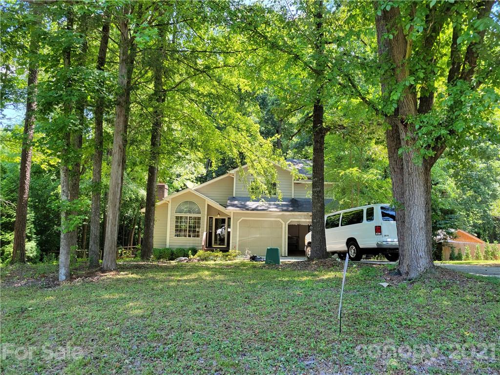 9640 Surrey Road Mint Hill, NC 28227 - Photo 1 of 18 a view of a house with backyard and a tree