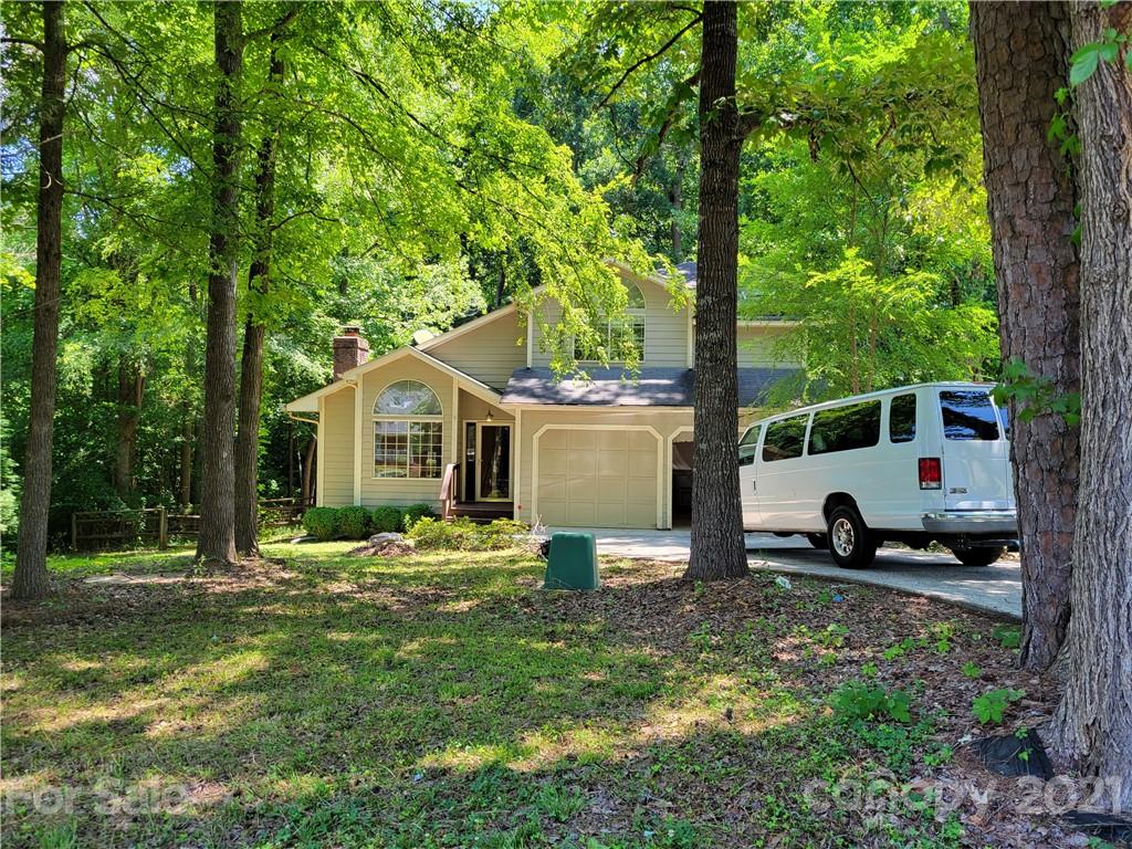 9640 Surrey Road Mint Hill, NC 28227 - Photo 2 of 18 a house view with a sitting space and garden