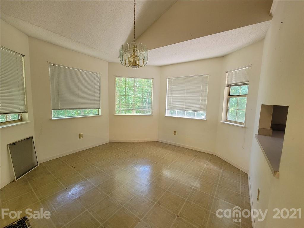 9640 Surrey Road Mint Hill, NC 28227 - Photo 11 of 18 a view of an empty room with a window