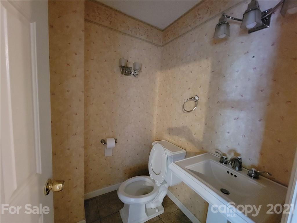 9640 Surrey Road Mint Hill, NC 28227 - Photo 5 of 18 a bathroom with a sink toilet and shower