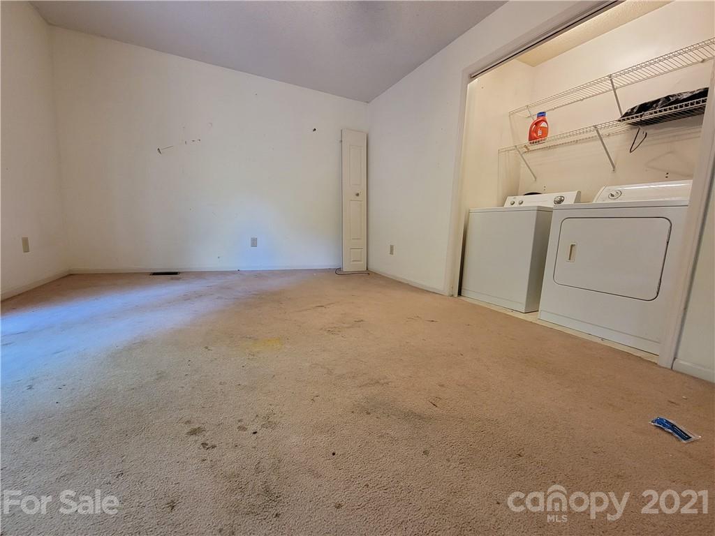 9640 Surrey Road Mint Hill, NC 28227 - Photo 6 of 18 a utility room with dryer and washer