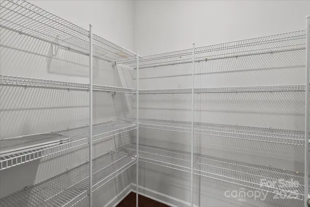 a kitchen with granite countertop a sink stove and cabinets