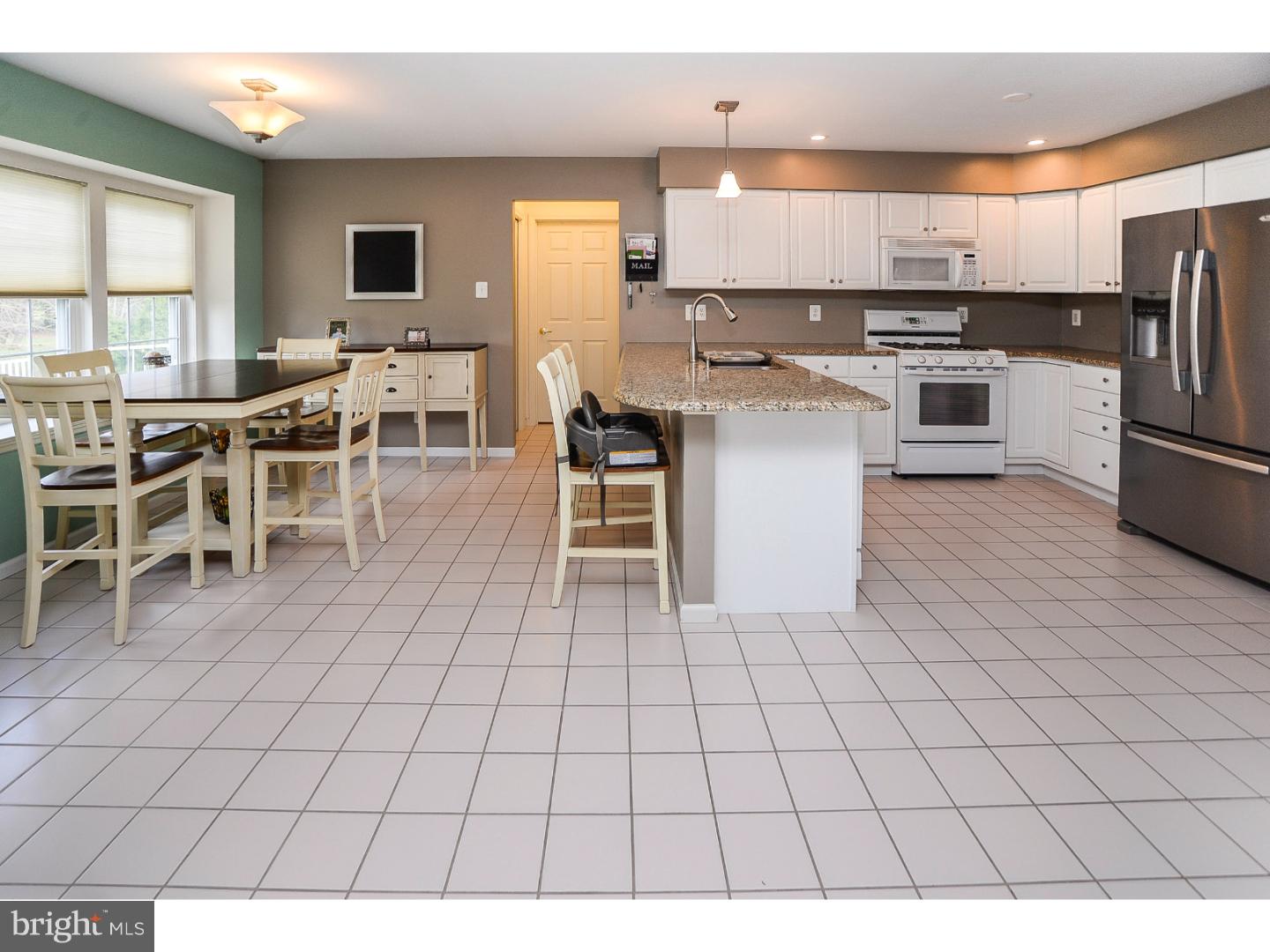 a kitchen with stainless steel appliances a sink counter space and a window