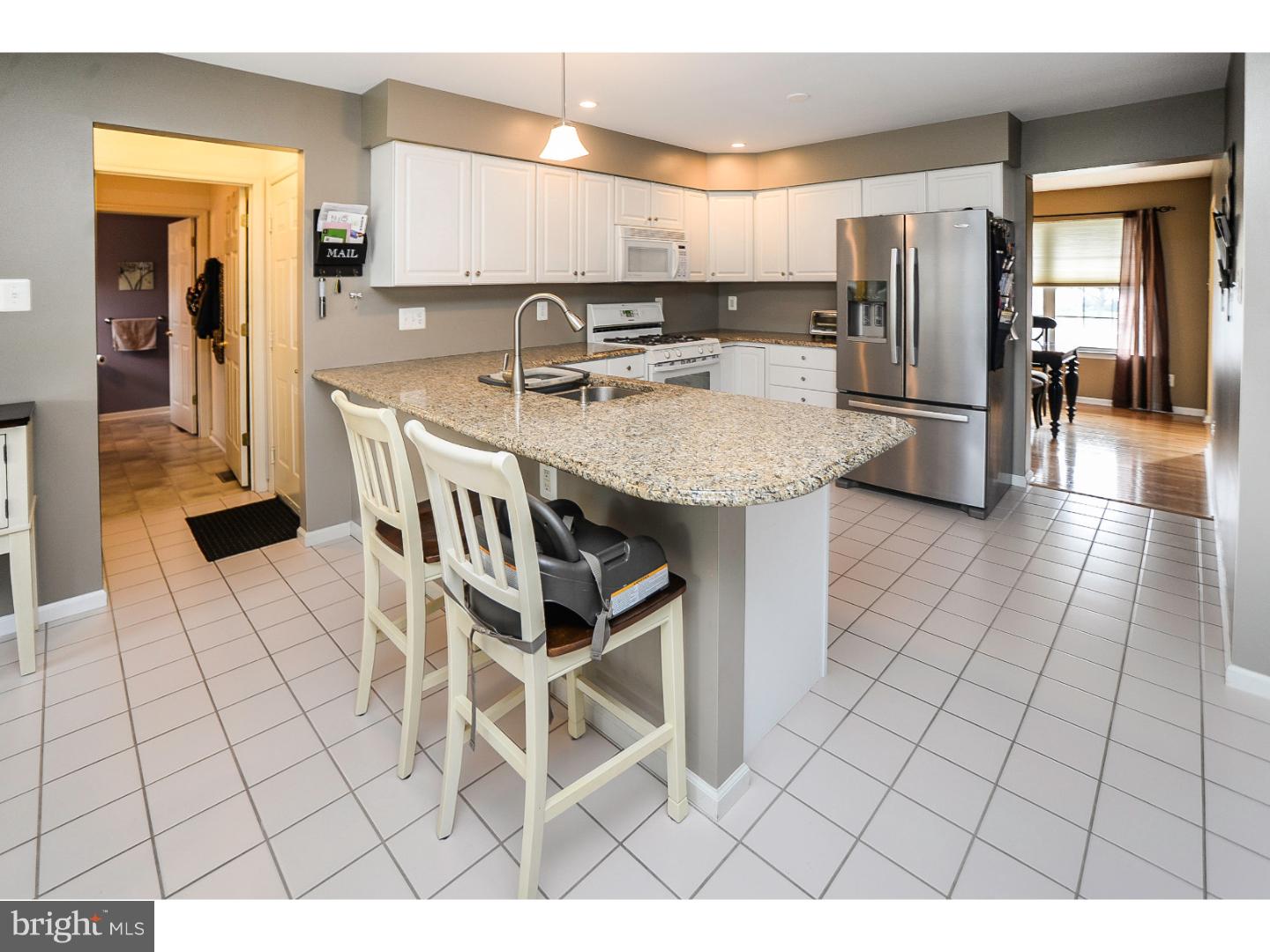 22 Stone Ridge Drive Mickleton, NJ 08056 - Photo 2 of 25 a kitchen with stainless steel appliances a sink a stove a refrigerator and cabinets