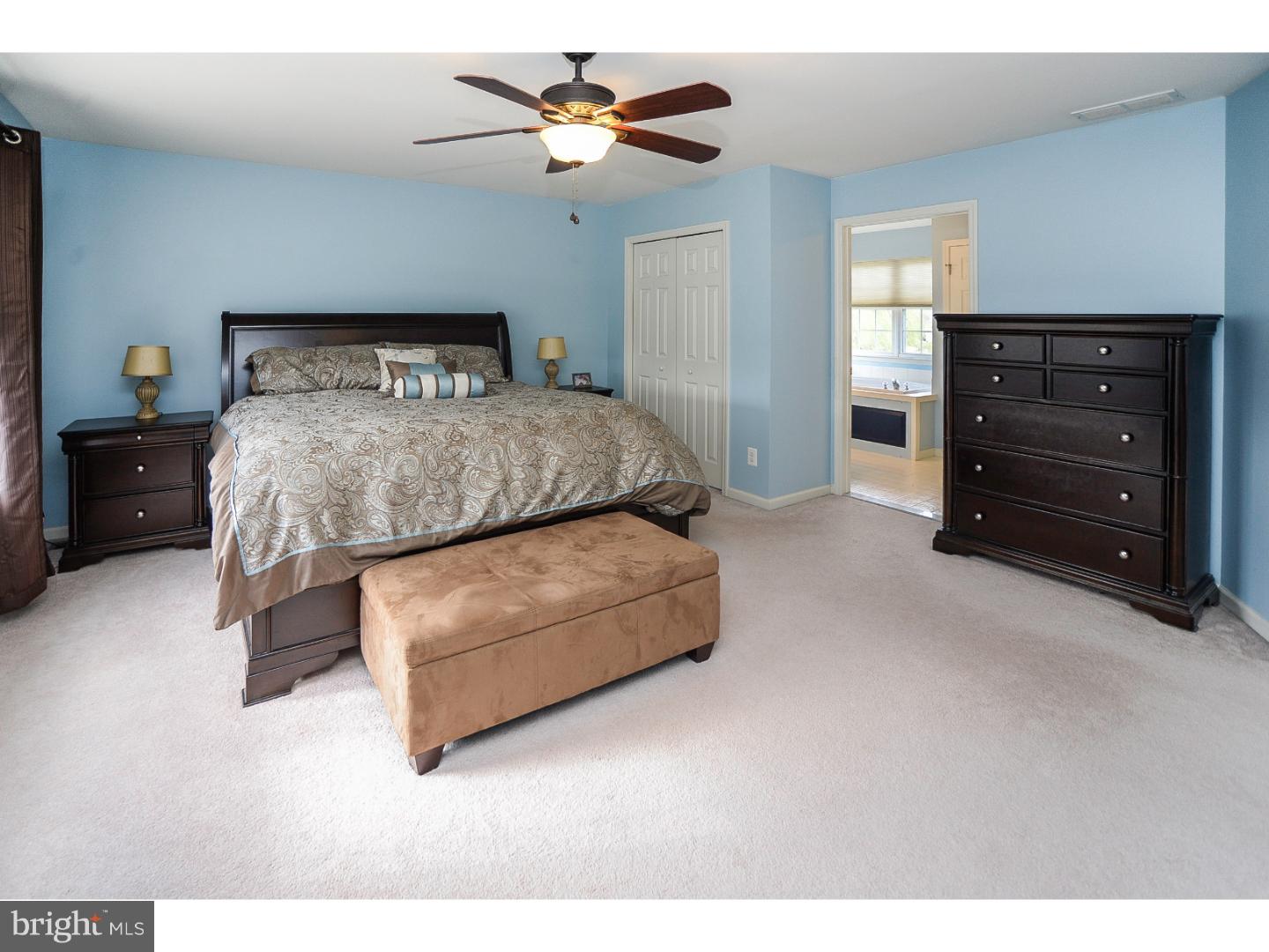 22 Stone Ridge Drive Mickleton, NJ 08056 - Photo 13 of 25 a bedroom with a bed and a chandelier