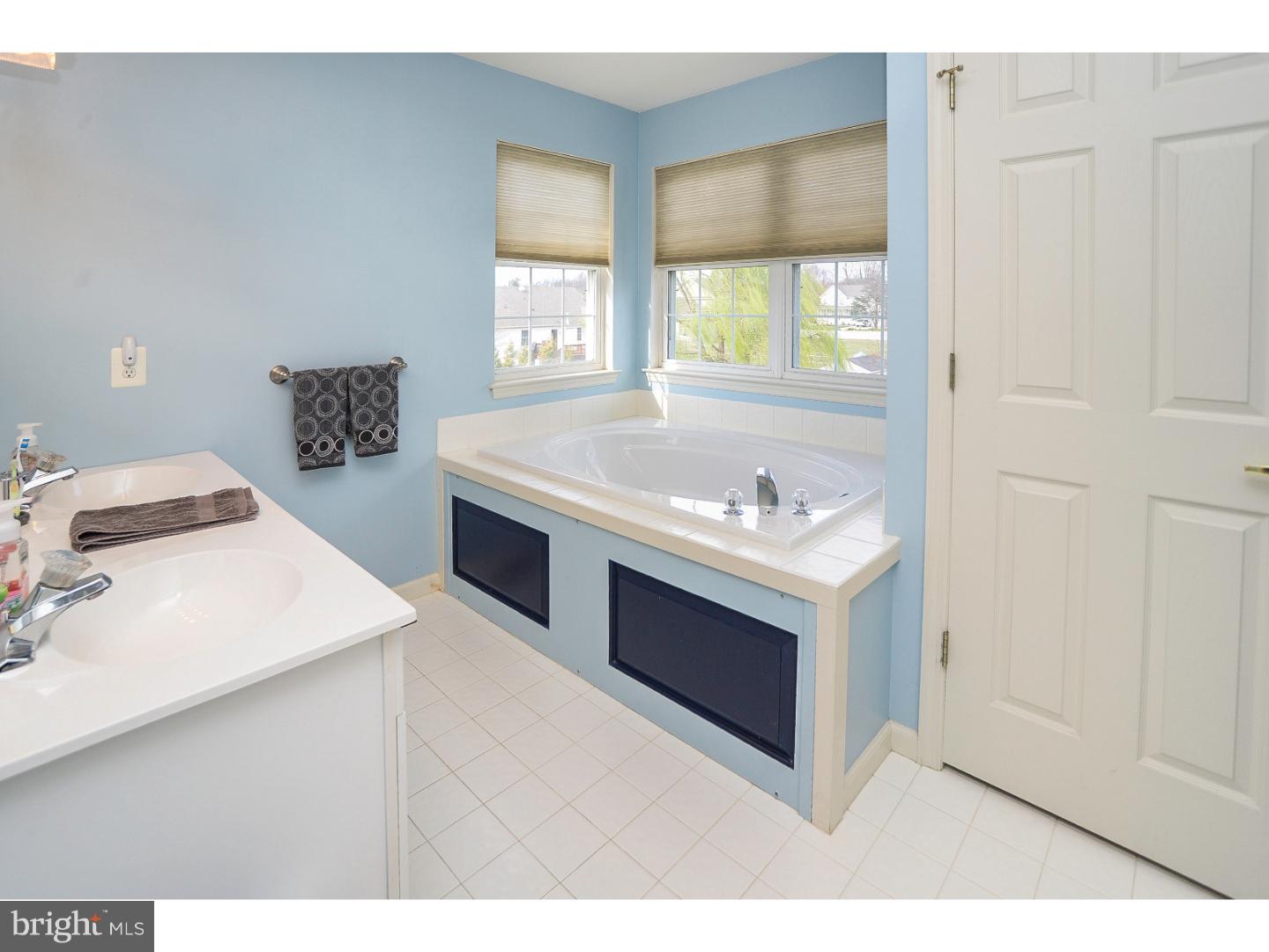 22 Stone Ridge Drive Mickleton, NJ 08056 - Photo 15 of 25 a bathroom with a sink vanity and a mirror