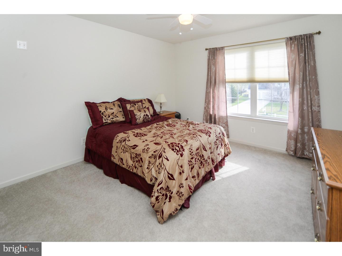 22 Stone Ridge Drive Mickleton, NJ 08056 - Photo 18 of 25 a bed sitting in a bedroom next to a window