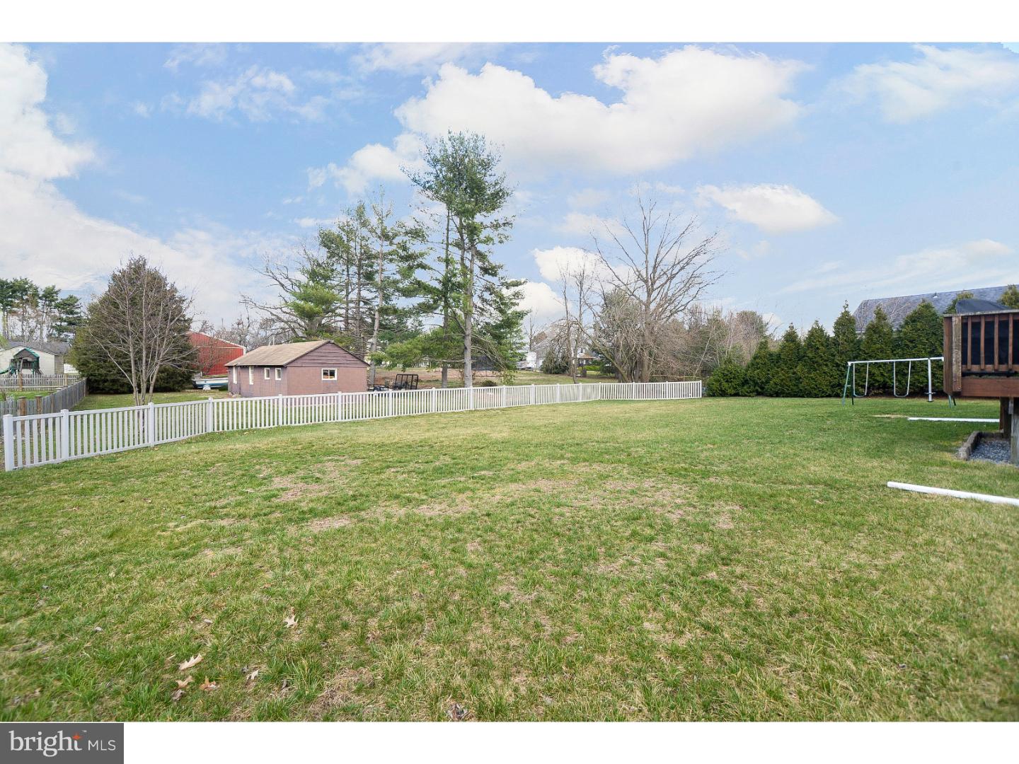 22 Stone Ridge Drive Mickleton, NJ 08056 - Photo 19 of 25 a view of a green field with wooden fence
