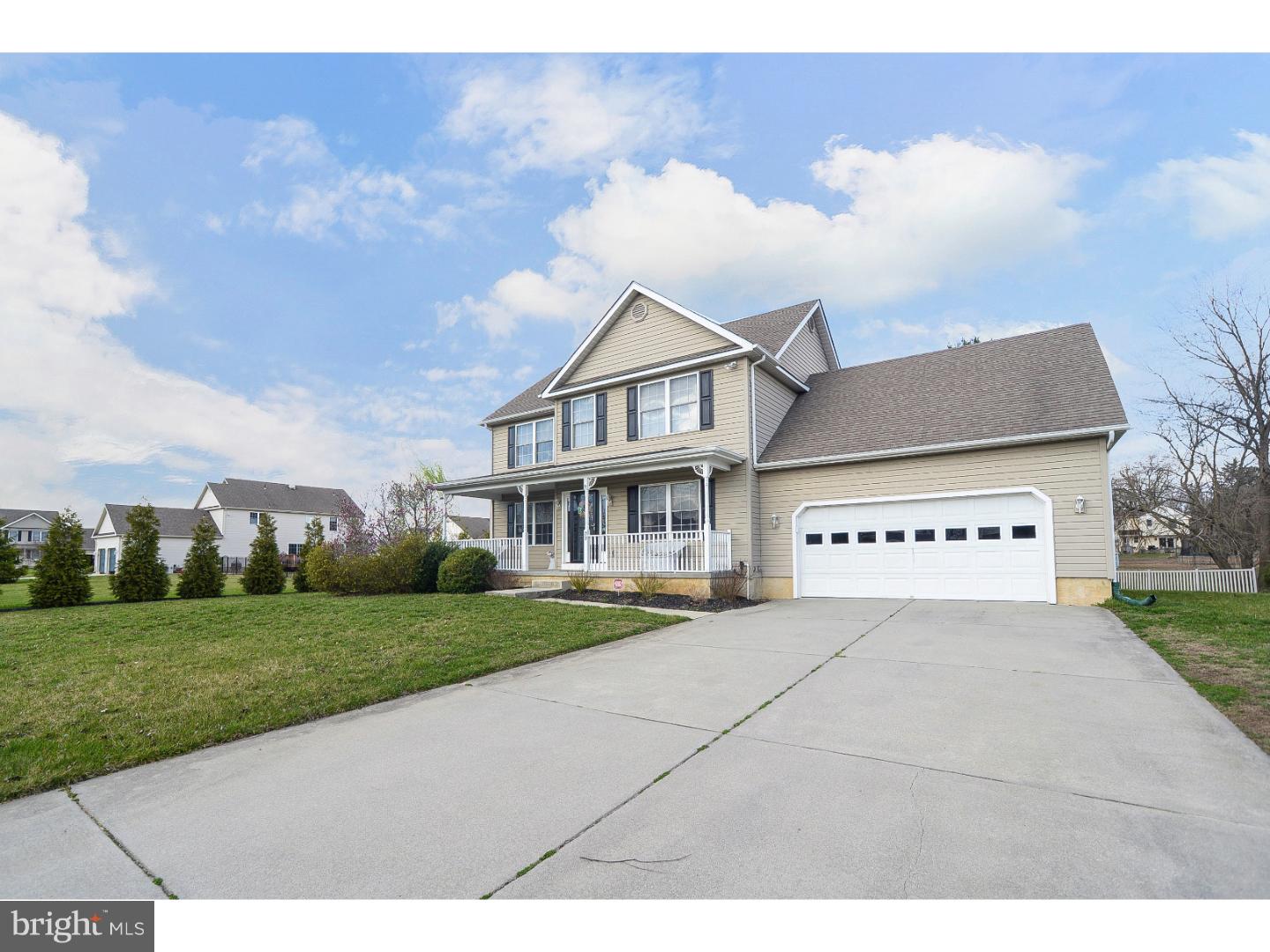 22 Stone Ridge Drive Mickleton, NJ 08056 - Photo 21 of 25 a front view of a house with a garden and yard