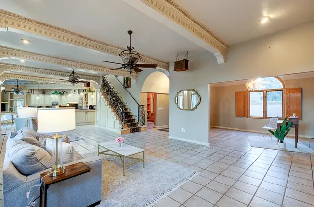 a kitchen with stainless steel appliances kitchen island granite countertop a stove a sink and a refrigerator