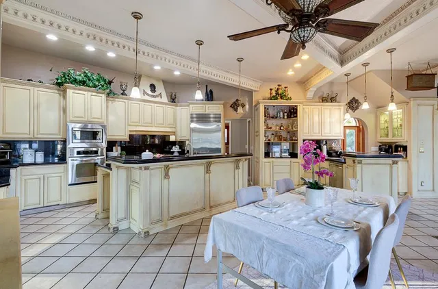 a kitchen with stainless steel appliances granite countertop a sink and cabinets
