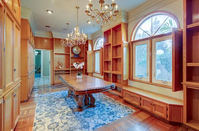 a view of a livingroom with wooden floor and a flat screen tv