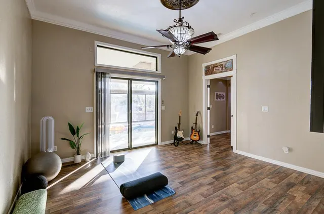 a view of a hallway view with wooden floor and staircase
