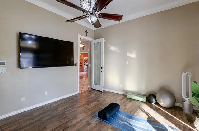 a large spacious bathroom with a granite countertop double vanity sink a mirror and a bathtub