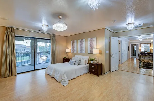 a bathroom with a sink a washer and dryer next to a window