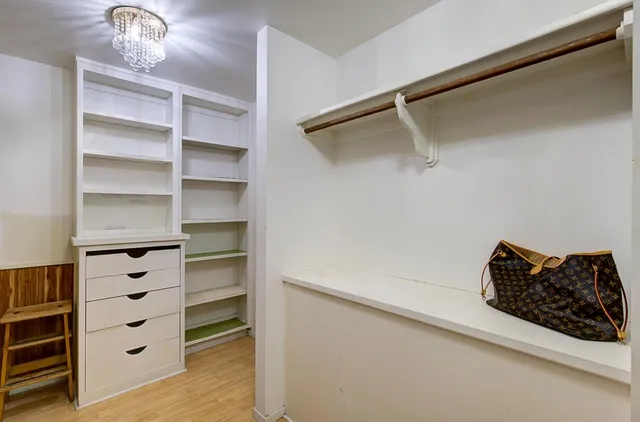 an aerial view of a house with a yard and potted plants