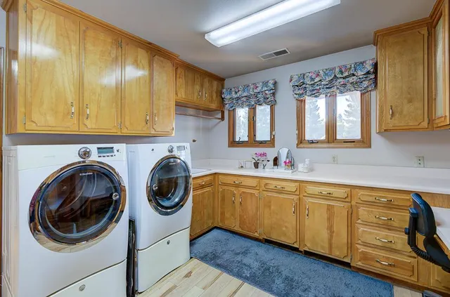an aerial view of lake and residential houses with outdoor space