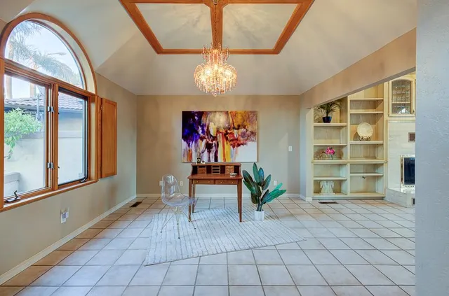 a lobby with furniture and floor to ceiling window