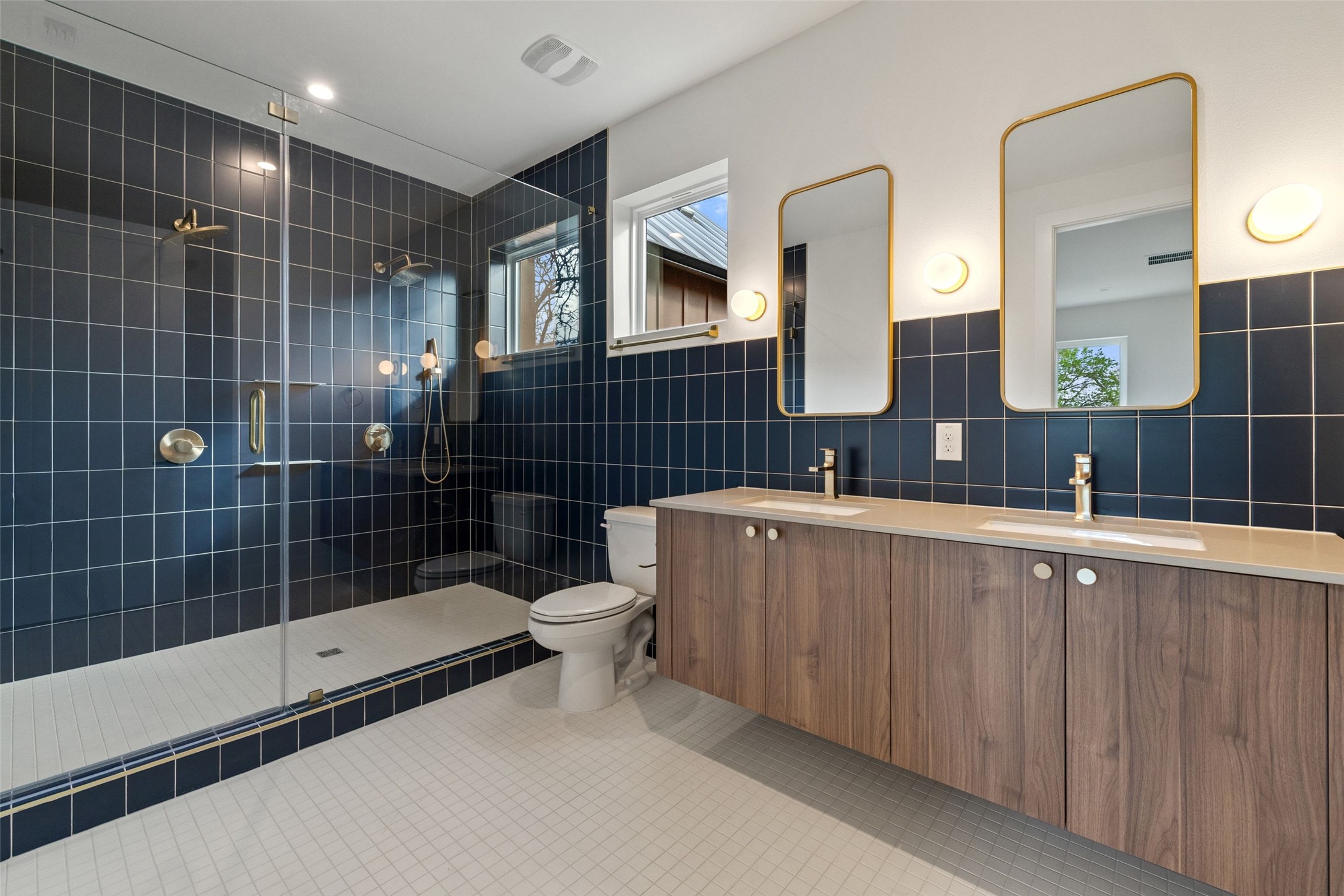 732 Springdale Road, Unit A Austin, TX 78702 - Photo 3 of 3 A well-lit primary bathroom with modern fixtures and a spacious walk-in shower.