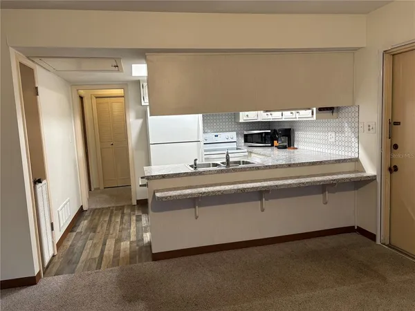 a room with a sink and a mirror