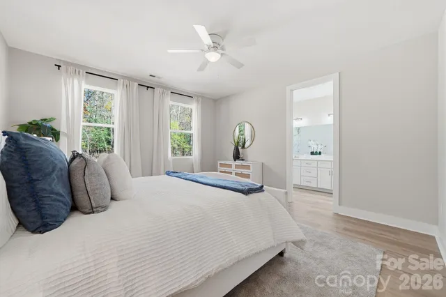 a bedroom with a large bed and a large window