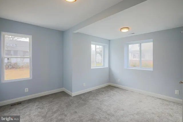 an empty room with windows