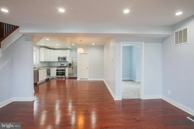a view of a kitchen with a sink and an oven