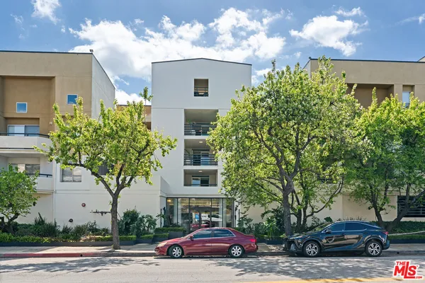 a view of street with parked cars
