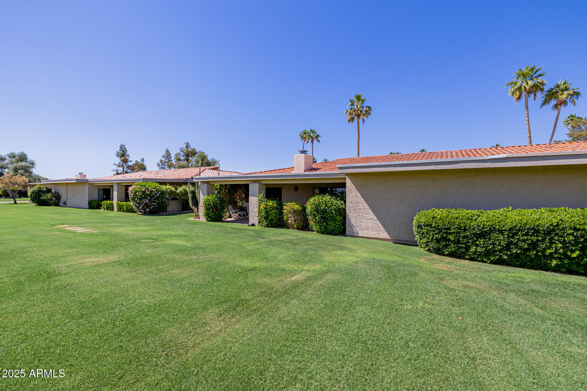 7615 East Tucson Road Scottsdale, AZ 85258 - Photo 44 of 54 a view of a garden with a house