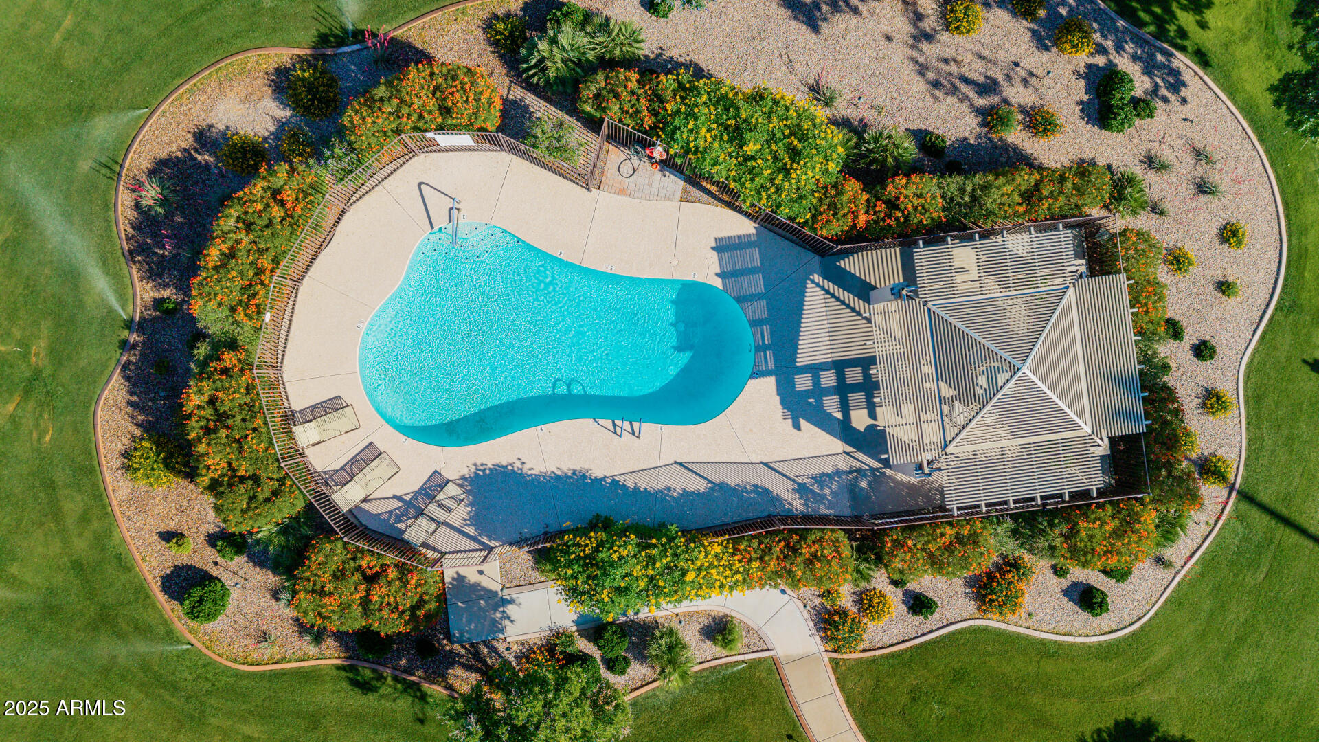 7615 East Tucson Road Scottsdale, AZ 85258 - Photo 47 of 54 an aerial view of a house with a swimming pool and garden